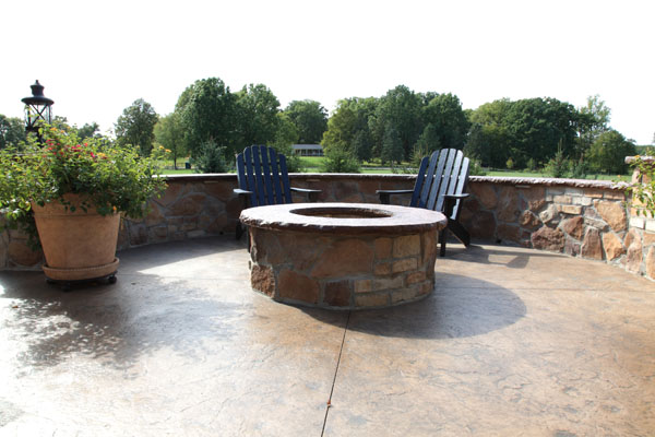 Round Wood Burning Firepit with Stone Wall Seating